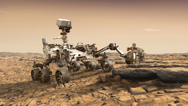 In this illustration made available by NASA, the Mars 2020 Perseverance rover studies a Mars rock outrcrop. (NASA/JPL-Caltech via AP)