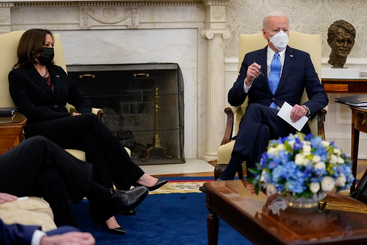 President Joe Biden and Vice President Kamala Harris attend a meeting with a bipartisan group of mayors and governors to discuss a coronavirus relief package, in the Oval Office of the White House, Friday, Feb. 12, 2021, in Washington