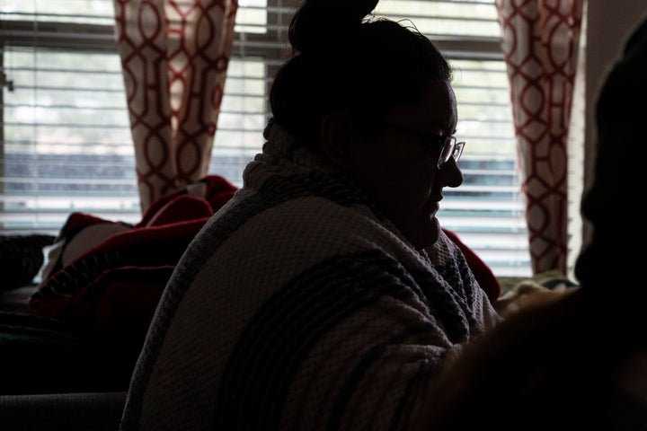 Esperanza Gonzalez wraps herself in a blanket to stay warm in her apartment during power outage caused by the winter storm on February 16, 2021 in Houston, Texas. Winter storm Uri has brought historic cold weather, power outages and traffic accidents to Texas as storms have swept across 26 states with a mix of freezing temperatures and precipitation. 