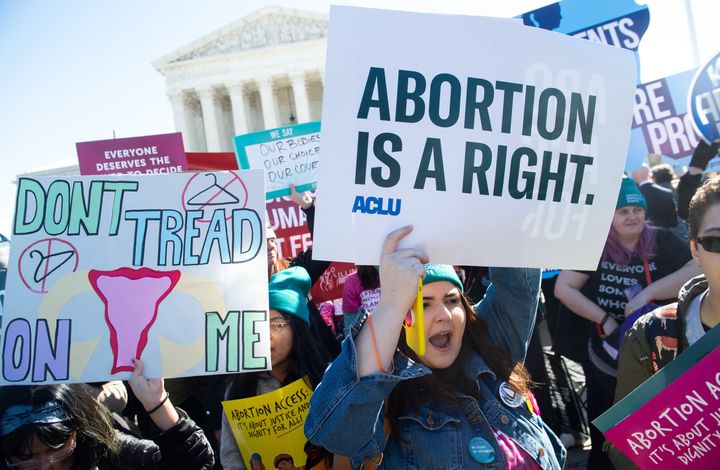 Abortion rights activists demonstrate outside the U.S. Supreme Court on March 4, 2020, as the justices hear arguments on a Louisiana law restricting abortion access. The court's strengthened conservative tilt has emboldened more states to try to curb abortion rights.