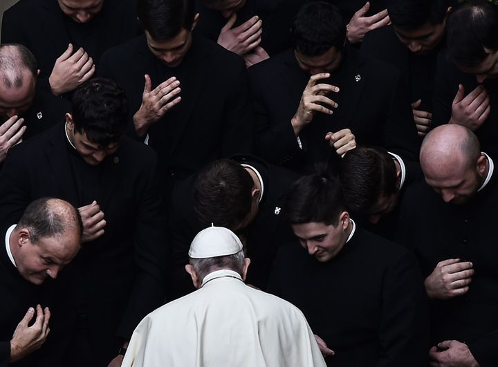 Pope Francis prays with priests at the end of a limited public audience at the San Damaso courtyard in The Vatican on September 30, 2020 during the COVID-19 infection, caused by the novel coronavirus. 