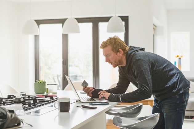 Man making online credit card payment