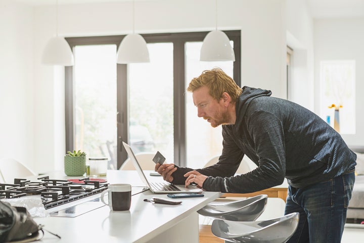 Man making online credit card payment