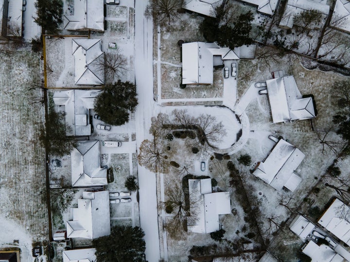 Homes in Houston's Westbury neighborhood covered in snow.
