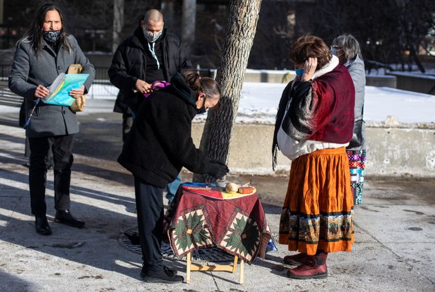 Donna McLeod, Cindy Gladue's mom, takes part in smudging during a rally for Cindy Gladue outside the...