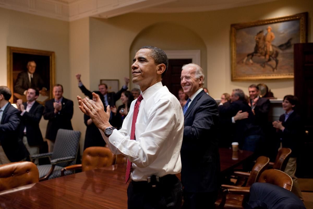 Joe Biden, seen here with then-President Barack Obama celebrating House passage of the Affordable Care Act in 2010, now has a chance to reinforce and build on the health care law in a way that Obama never did.