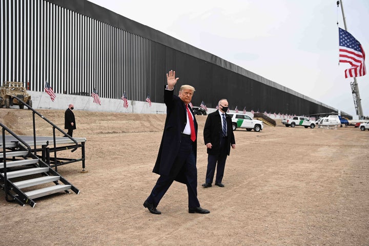 Donald Trump waves after speaking and touring a section of the border wall in Alamo, Texas, near the end of his presidency on Jan. 12. It isn't clear what President Joe Biden plans to do with the portions of wall that was built.