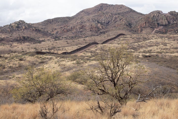 A new section of the border wall built under President Donald Trump extends through the remote wilderness of the Coronado Nat