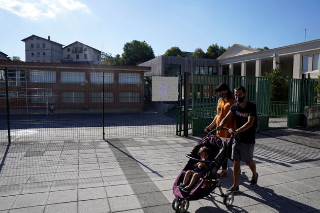 A couple walks past Zaldibar primary school last September 