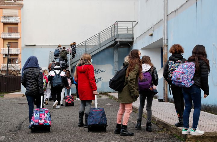 Middle school children return to the Cesare Piva school, while elder children continue studies online, as part of Italy's the coronavirus disease (COVID-19) regulations after the holidays, in Rome last month.