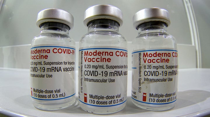 Three vials of Moderna's COVID-19 vaccine are seen here in Berlin on Feb. 17, 2021. Canada will receive 168,000 shots this week from Moderna, which ships its doses every three weeks.