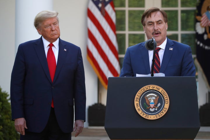 In this March 30, 2020, file photo, My Pillow CEO Mike Lindell speaks as then-President Donald Trump listens during a briefing about the coronavirus in the Rose Garden of the White House, in Washington.