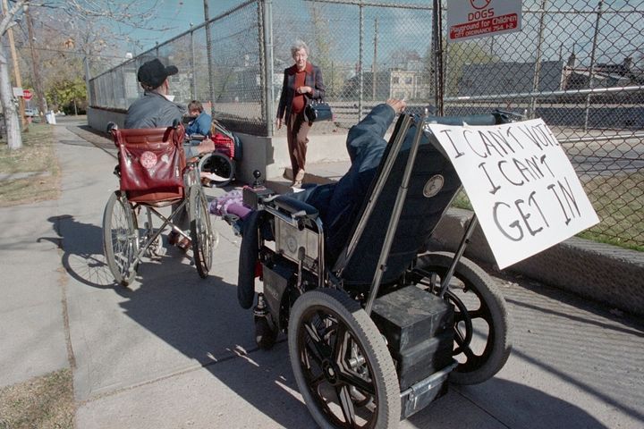 Two major obstacles disabled people face while voting in person are waiting in lines and accessing voting sites. (File photo from Nov. 8, 1988, Denver, Colorado) 