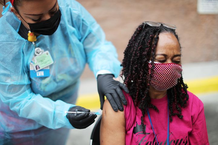Guest services tech Felecia Weathersby, 65, receives a coronavirus vaccination in Los Angeles on Feb. 10, 2021.