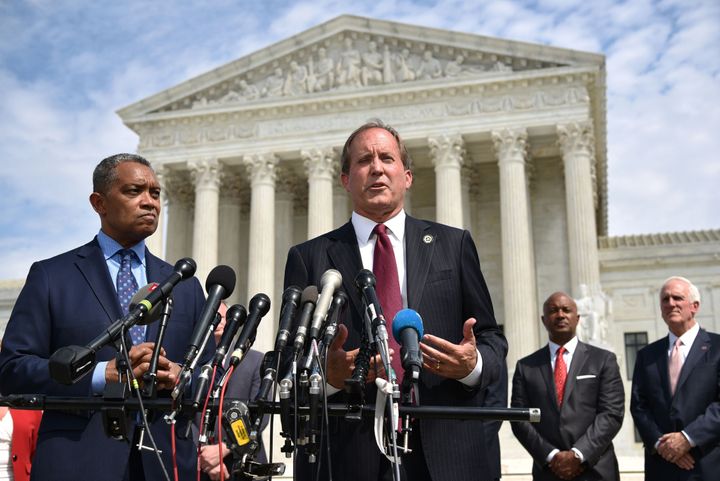 Texas Attorney General Ken Paxton (center) traveled to Utah last week during the winter storms that claimed dozens of lives and <a href="https://www.huffpost.com/entry/power-outages-texas-winter-snow_n_602d8719c5b673b19b65c341" role="link" class=" js-entry-link cet-internal-link" data-vars-item-name="knocked out power to millions" data-vars-item-type="text" data-vars-unit-name="60349666c5b66da5dba3e185" data-vars-unit-type="buzz_body" data-vars-target-content-id="https://www.huffpost.com/entry/power-outages-texas-winter-snow_n_602d8719c5b673b19b65c341" data-vars-target-content-type="buzz" data-vars-type="web_internal_link" data-vars-subunit-name="article_body" data-vars-subunit-type="component" data-vars-position-in-subunit="1">knocked out power to millions</a> of residents.
