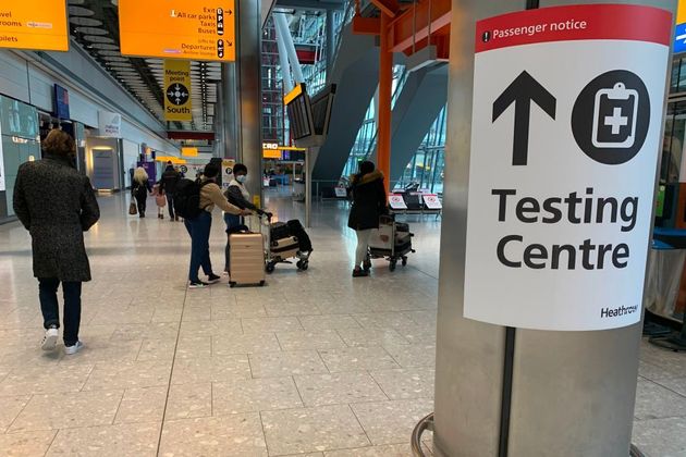 A sign points the way for a Covid-19 testing centre at Terminal 5 in at London Heathrow Airport in west London