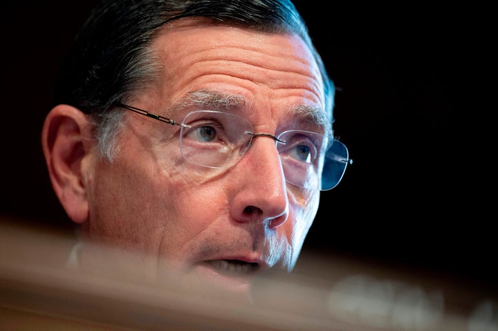 Sen. John Barrasso (R-Wyo.) questions Haaland at a committee hearing on her nomination.