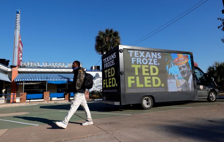 A digital billboard truck in Houston calls out Sen. Ted Cruz (R-Texas) for going to Mexico as a deadly winter storm struck hi