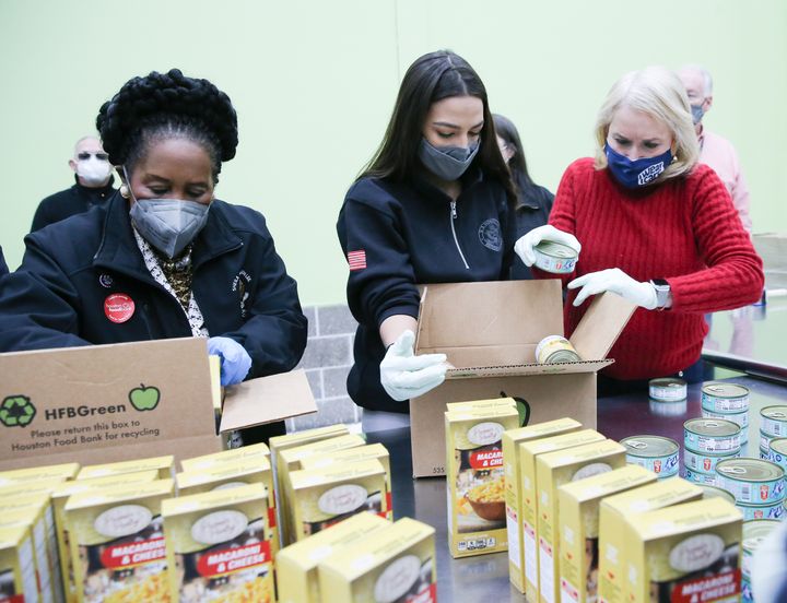 Democratic Reps. Sheila Jackson Lee (Texas), Alexandria Ocasio-Cortez (N.Y.) and Sylvia Garcia (Texas) help distribute food at the Houston Food Bank on Feb. 20.