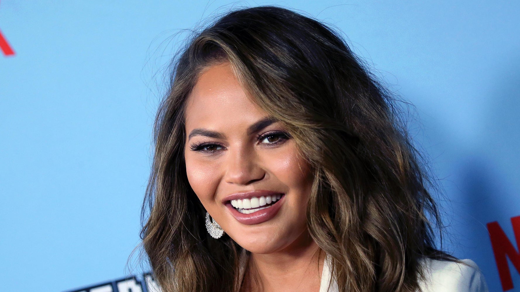 Chrissy Teigen Hilarously Begs Joe Biden to Unfollow her on Twitter