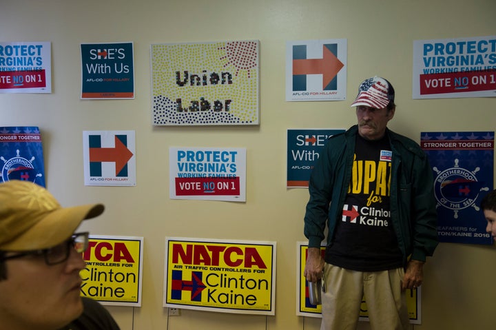 Union workers Johnathan Brown, a member of IBEW Local 26, left, and Guy Martin meet before going out to canvas Virginia neighborhoods to get out the vote in Annandale, Virginia, on Oct. 18, 2016.