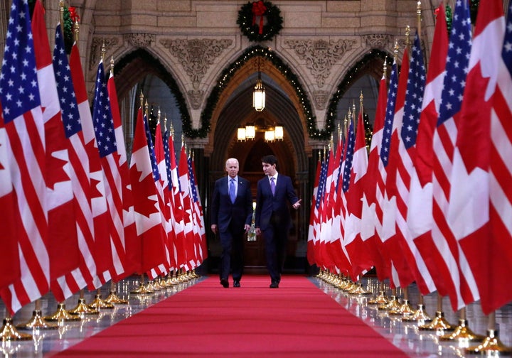 File photo of Prime Minister Justin Trudeau and U.S. Vice-President Joe Biden walking down the Hall of Honour on Parliament Hill in Ottawa on Dec. 9, 2016.