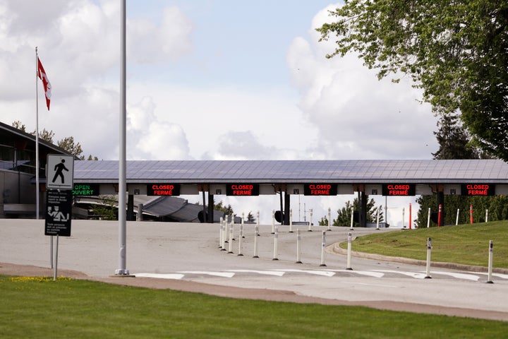 In this photo taken May 17, 2020, a single lane remains heading into Canada from the U.S. at the Peace Arch border crossing in Blaine, Wash.