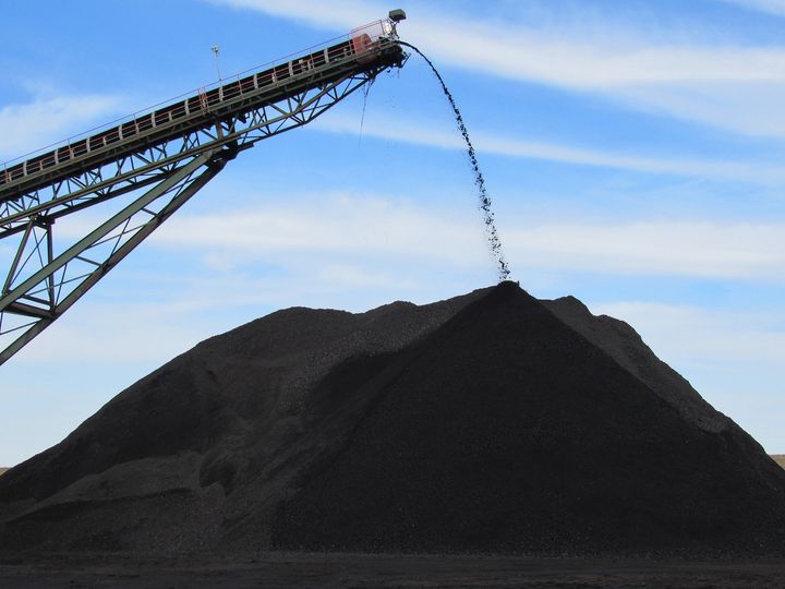 Coal from an underground mine in Muhlenberg County, Kentucky, pours off the end of a conveyor onto a pile used to load trucks for delivery in December 2018.