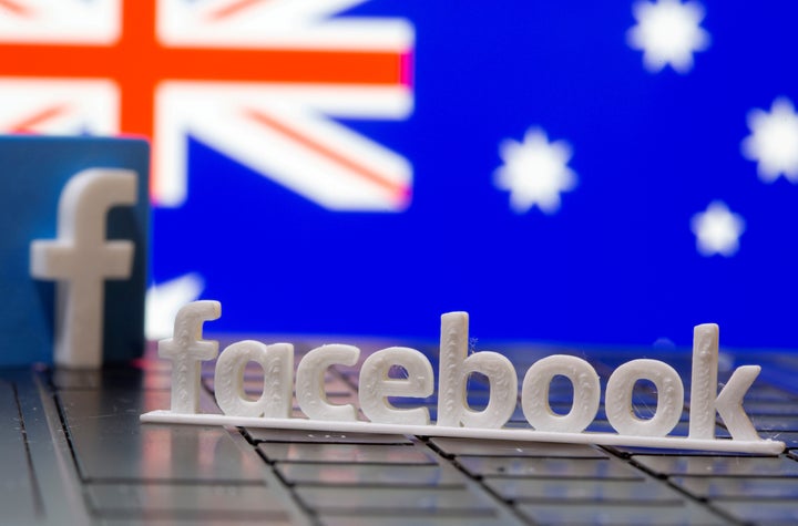 A 3D printed Facebook logo is seen in front of displayed Australia's flag in this illustration photo taken February 18, 2021. 