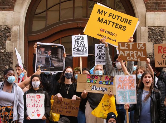 Students take part in a protest through outside the Department for Education last August