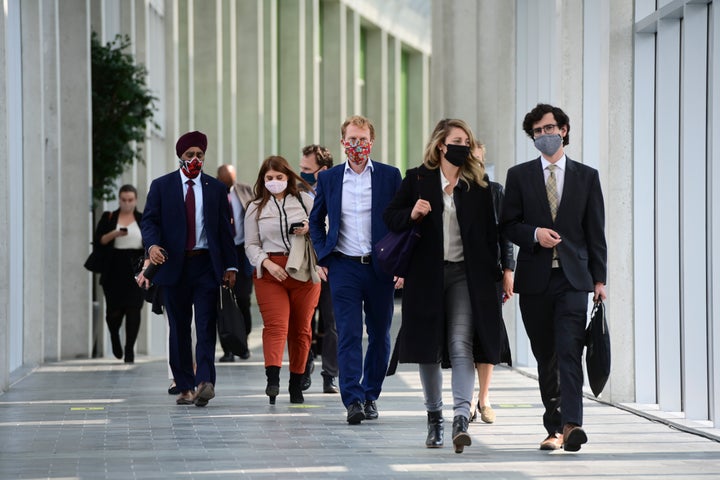 Minister of National Defence Harjit Sajjan, left to right, Minister of Indigenous Services Marc Miller, and Minister of Economic Development and Official Languages Melanie Joly and staff leave on the third and final day of the Liberal cabinet retreat in Ottawa on Sept. 16, 2020.