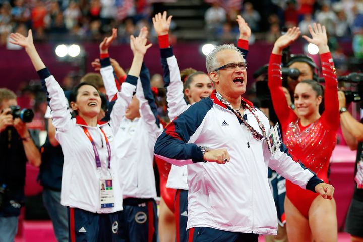 U.S. women's gymnastics coach John Geddert celebrates during the final rotation in the Artistic Gymnastics Women's Team final at the 2012 London Olympics.