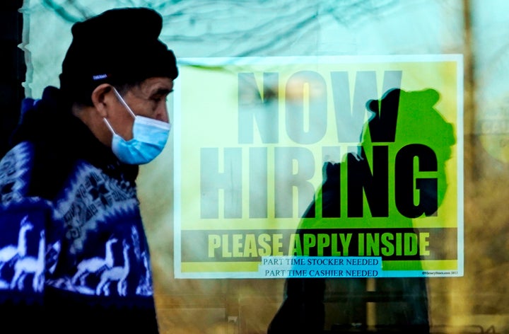 A store displaying a hiring sign in Wheeling, Illinois.