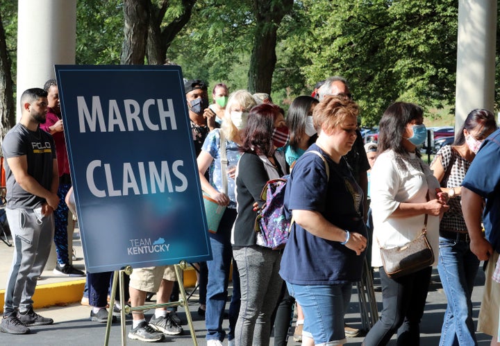 Hundreds of unemployed Kentucky residents wait outside the Kentucky Career Center for help with their unemployment claims on June 19, 2020, in Frankfort, Kentucky.