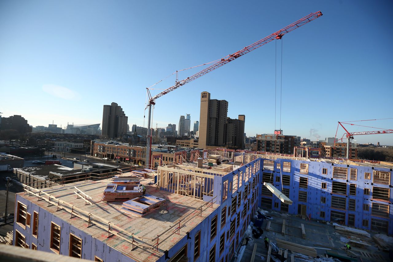 A 280-unit apartment building under construction in Minneapolis in 2017. Nearly three-quarters of Minneapolis’ emissions came from buildings.
