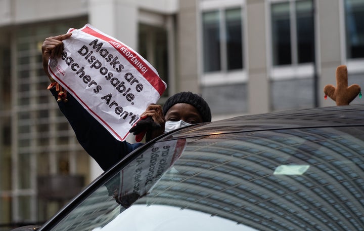 Teachers and supporters participate in a car caravan to demand a safe and equitable return to in-person learning in Chicago on Dec. 12, 2020. 