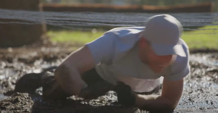 A member of the British royal family happily making his way through sludge is definitely not something you see every day.