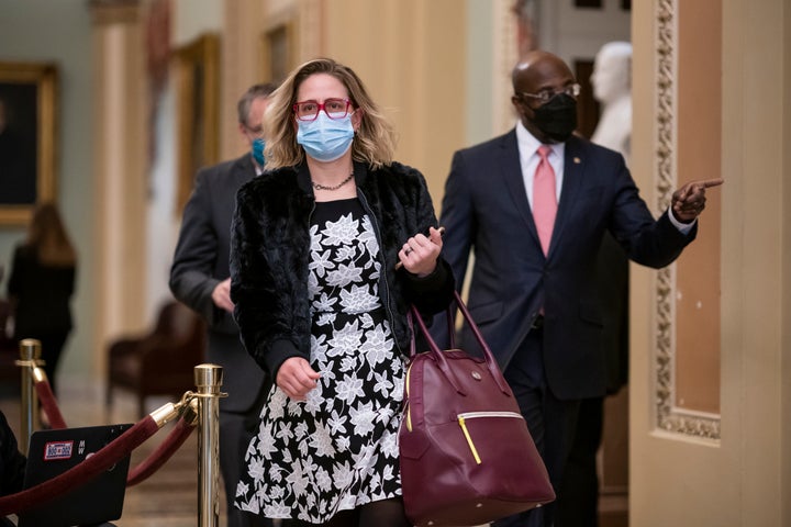 Democratic Sens. Kyrsten Sinema (Ariz.) and Raphael Warnock (Ga.) arrive at the second impeachment trial of former President Donald Trump.