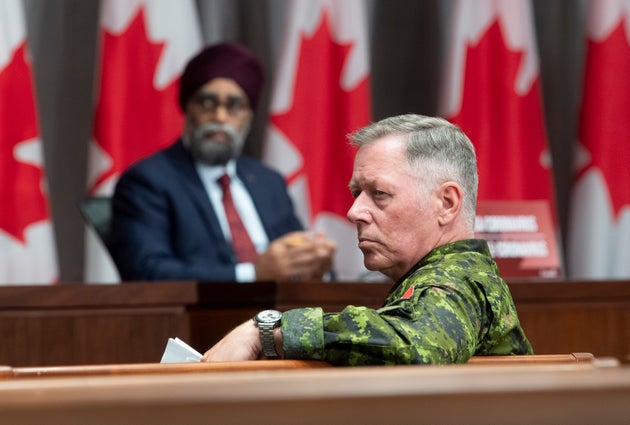 National Defence Minister Harjit Sajjan and Chief of Defence Staff Jonathan Vance listen to a question...