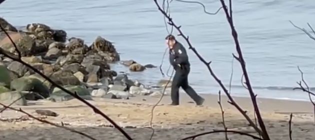 A screenshot from a video posted on Instagram of the officers allegedly posing with the body.