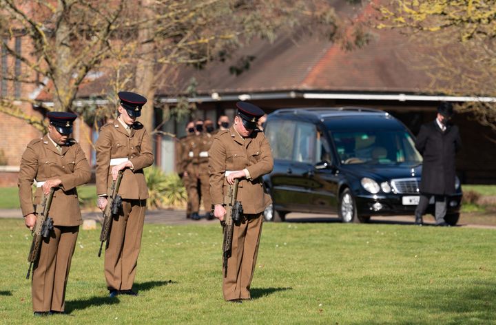 The funeral cortege of Captain Sir Tom Moore arrives at Bedford Crematorium.