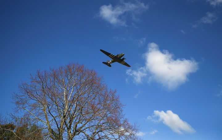 The C-47 Dakota, part of the Battle of Britain Memorial Flight which operates from RAF Coningsby in Lincolnshire, flies over the crematorium. 