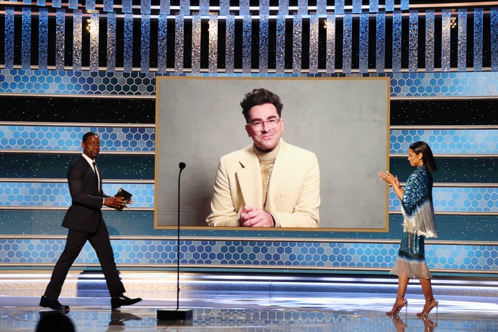 Dan Levy accepting thee Golden Globe for "Schitt's Creek."