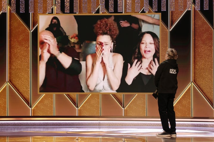 Andra Day (c) reacts after being named winner of the Best Actress - Motion Picture Drama award for ‘The United States vs. Billie Holiday’ via video by Joaquin Phoenix onstage at the 78th Annual Golden Globe Awards held at The Beverly Hilton and broadcast on February 28, 2021 in Beverly Hills, California.