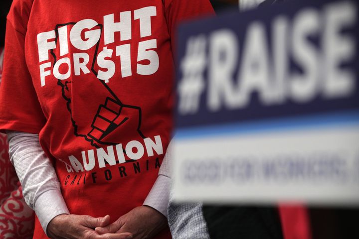 An activist wears a "Fight For $15" T-shirt prior to a vote on the Raise the Wage Act at the U.S. Capitol on July 18, 2019. Progressives have fought for years to increase the federal minimum wage from $7.25.