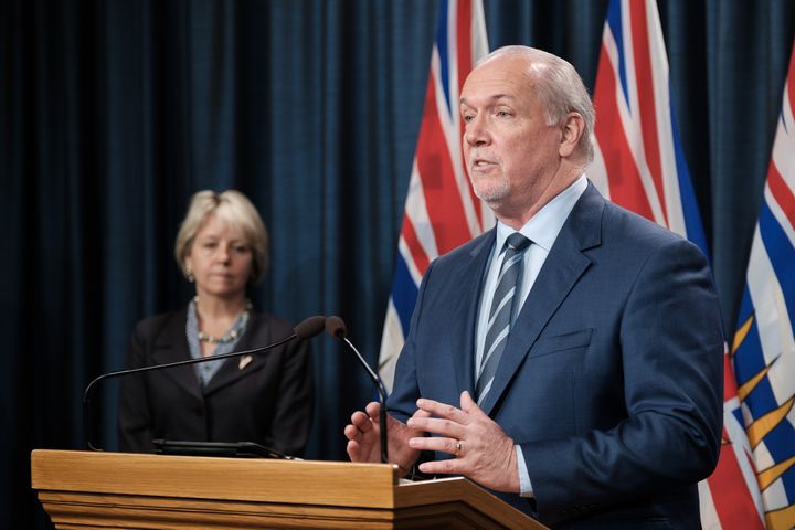 B.C. premier John Horgan and chief medical officer Dr. Bonnie Henry speak at a news conference on Mar. 1, 2021.