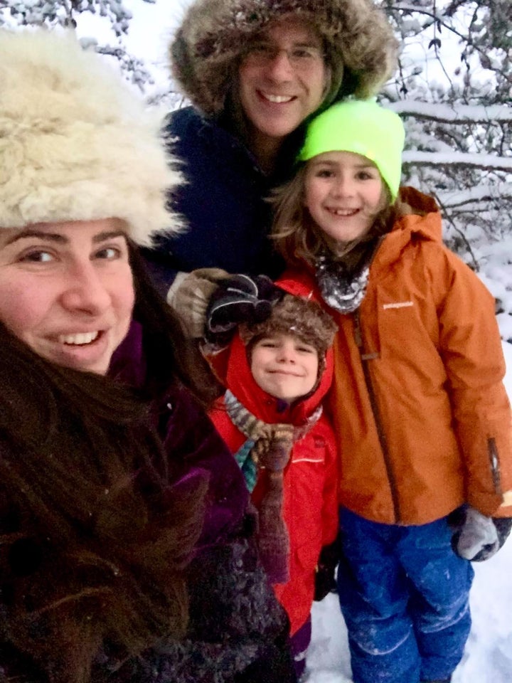 Carly Stasko, her husband Trevor, and their two kids pose outside.