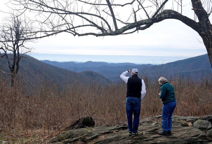 Gregory Buppert, a Southern Environmental Law Center attorney, and Lynn Cameron, a Virginia Wilderness Committee board member, survey a spot along the Appalachian Trail in February 2020 near Wintergreen. In the valley below them is where the Atlantic Coast Pipeline would emerge.