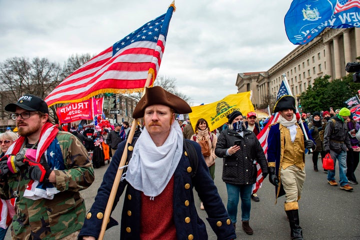 Trump supporters sporting an array of looks head toward the Capitol after he delivered an incendiary speech at a rally on the National Mall.