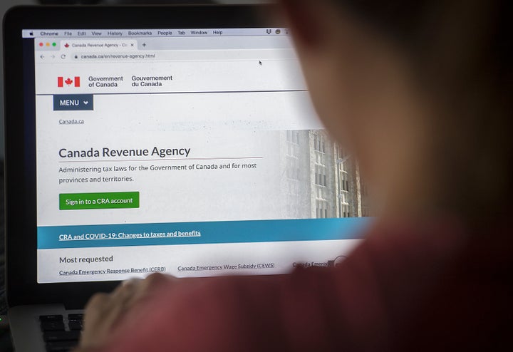 A person looks at a Canada Revenue Agency homepage in Montreal on Aug. 16, 2020.